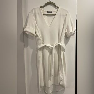 White, belted shirt dress.